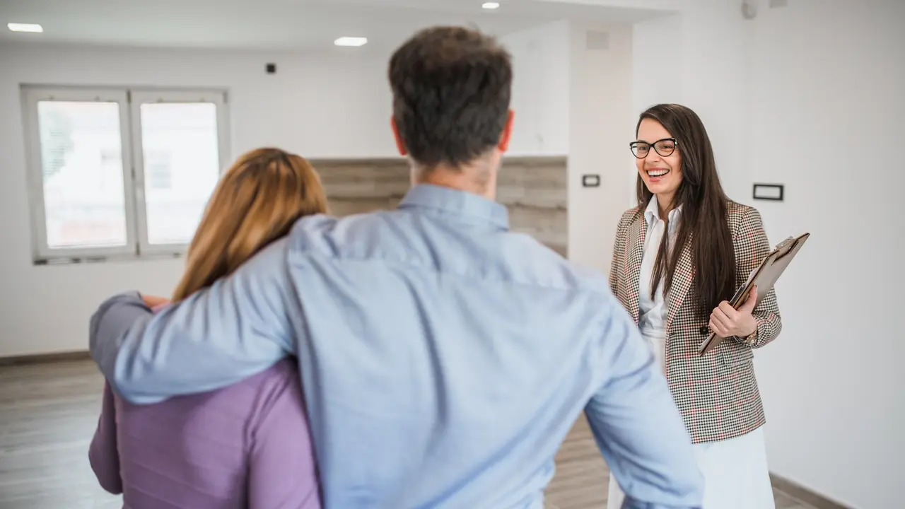 Couple and real estate agent stock photo