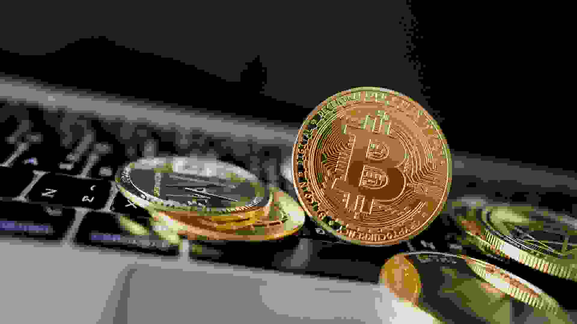 Photo Golden Bitcoins On laptop. Trading Concept Of Crypto Currency. stock photo