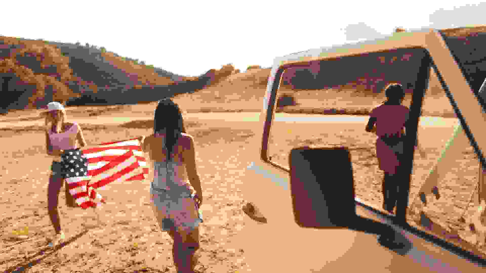 Two girlfriends taking a trip on Fourth of July stock photo