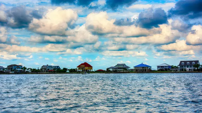 A group of residential buildings on stilts along the shores of Lake Pontchartrain in Slidell Louisiana, near New Orleans.