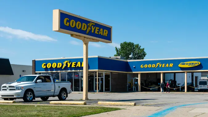 People approaching a Goodyear Tire and Service location in Madison Heights, Michigan.