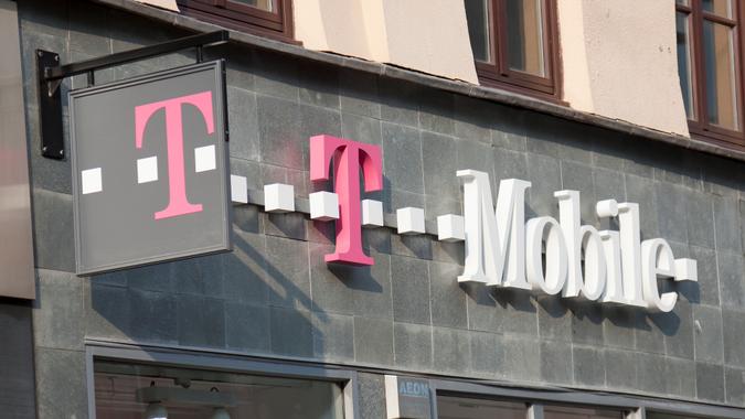 Glasgow, Scotland, UK - 19th April, 2011: Sign and logo above a branch of T-Mobile, a German based telecommunications provider owned by Deutsche Telekom, T-Mobile operates in certain European countries and in the US.