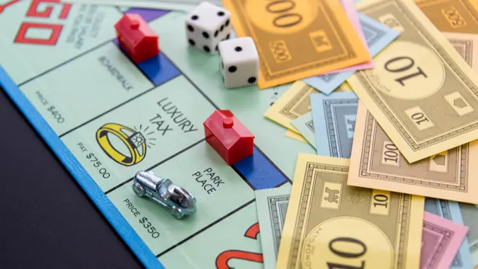 Houston, TX, USA - February 8, 2015: Monopoly Board Game - car on Park Place with hotel.
