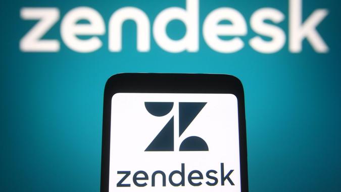 Mandatory Credit: Photo by Pavlo Gonchar/SOPA Images/Shutterstock (11857257x)In this photo illustration the Zendesk logo of an US software company is seen on a smartphone and a pc screen.