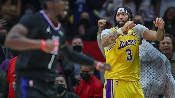 Mandatory Credit: Photo by Allen J Schaben/Los Angeles Times/Shutterstock (12789532b)Clippers point guard Reggie Jackson, left, celebrates his winning basket as Lakers forward Anthony Davis is dejected after missing his final shot in the final seconds at Crypto.