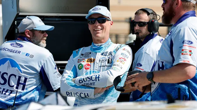Mandatory Credit: Photo by Colin E Braley/AP/Shutterstock (12940359e)Kevin Harvick, center, visits his crew along pit road before practice for a NASCAR Cup Series auto race at Kansas Speedway in Kansas City, KanNASCAR Kansas Auto Racing, Kansas City, United States - 14 May 2022.