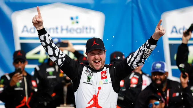 Mandatory Credit: Photo by Colin E Braley/AP/Shutterstock (12944712a)Kurt Busch celebrates in Victory Lane after winning a NASCAR Cup Series auto race at Kansas Speedway in Kansas City, KanNASCAR Kansas Auto Racing, Kansas City, United States - 15 May 2022.