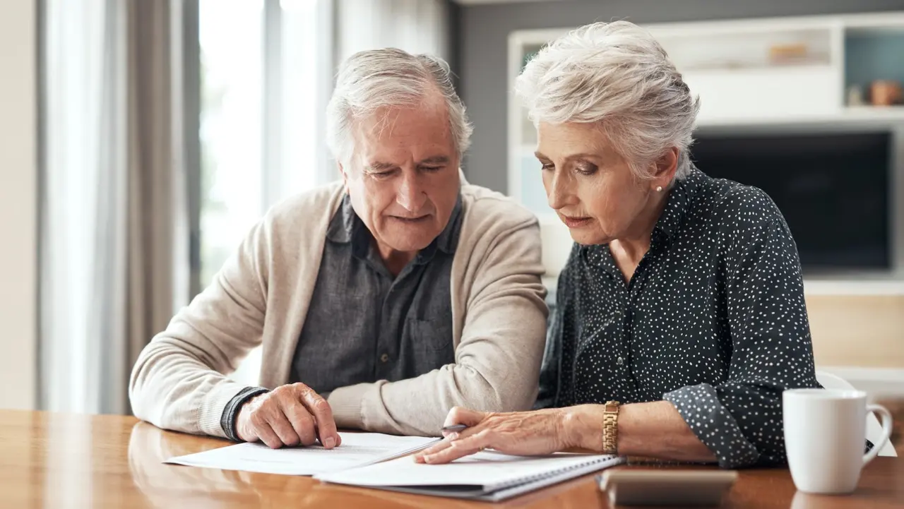 Cropped shot of a senior couple sitting together and going through their finances at home.