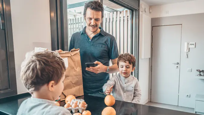 Family Returning Home From Shopping stock photo