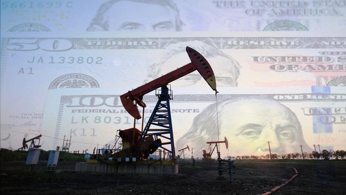 Petroleum, petrodollar and crude oil concept, Oil pump on background of US dollar, Dollars and oil pumps.