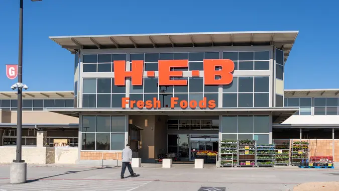 Pearland, Texas, USA - March 1, 2022: People walking to a H-E-B supermarket in Pearland, Texas, USA.