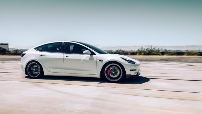 LA, CA, USA4/12/2022White Model 3 Tesla driving on the road.