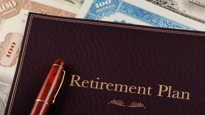 retirement plan portfolio on top of vintage stock certificates.