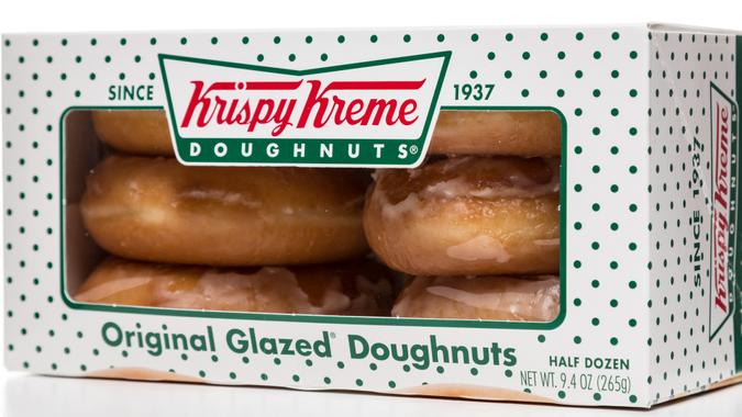 Miami, USA - April 20, 2014: Krispy Kreme original glazed doughnuts half dozen box.