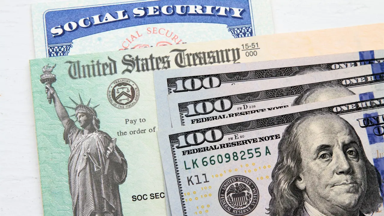 Partial view of Social Security card, US Treasury checks and hundred dollar bills.