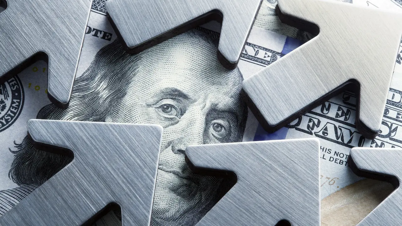 Arrows Surround The Face Of Benjamin Franklin On One Hundred Dollar B stock photo