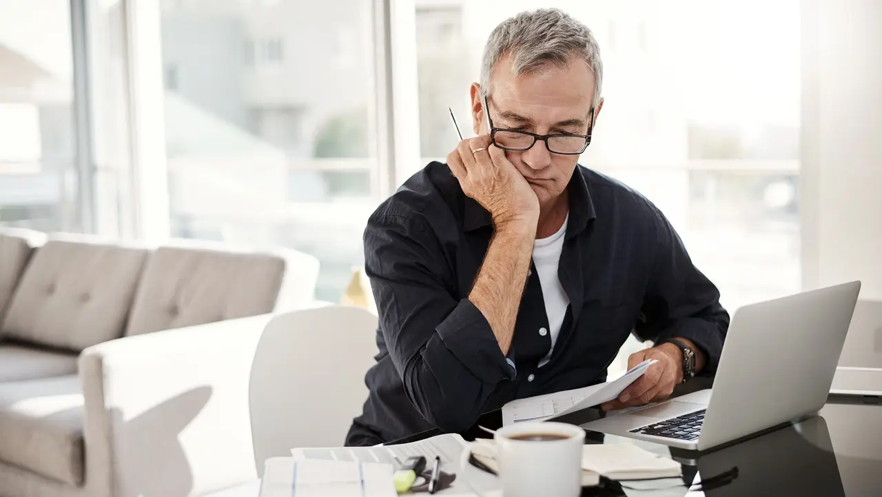 Pouring some time into tackling some paperwork stock photo
