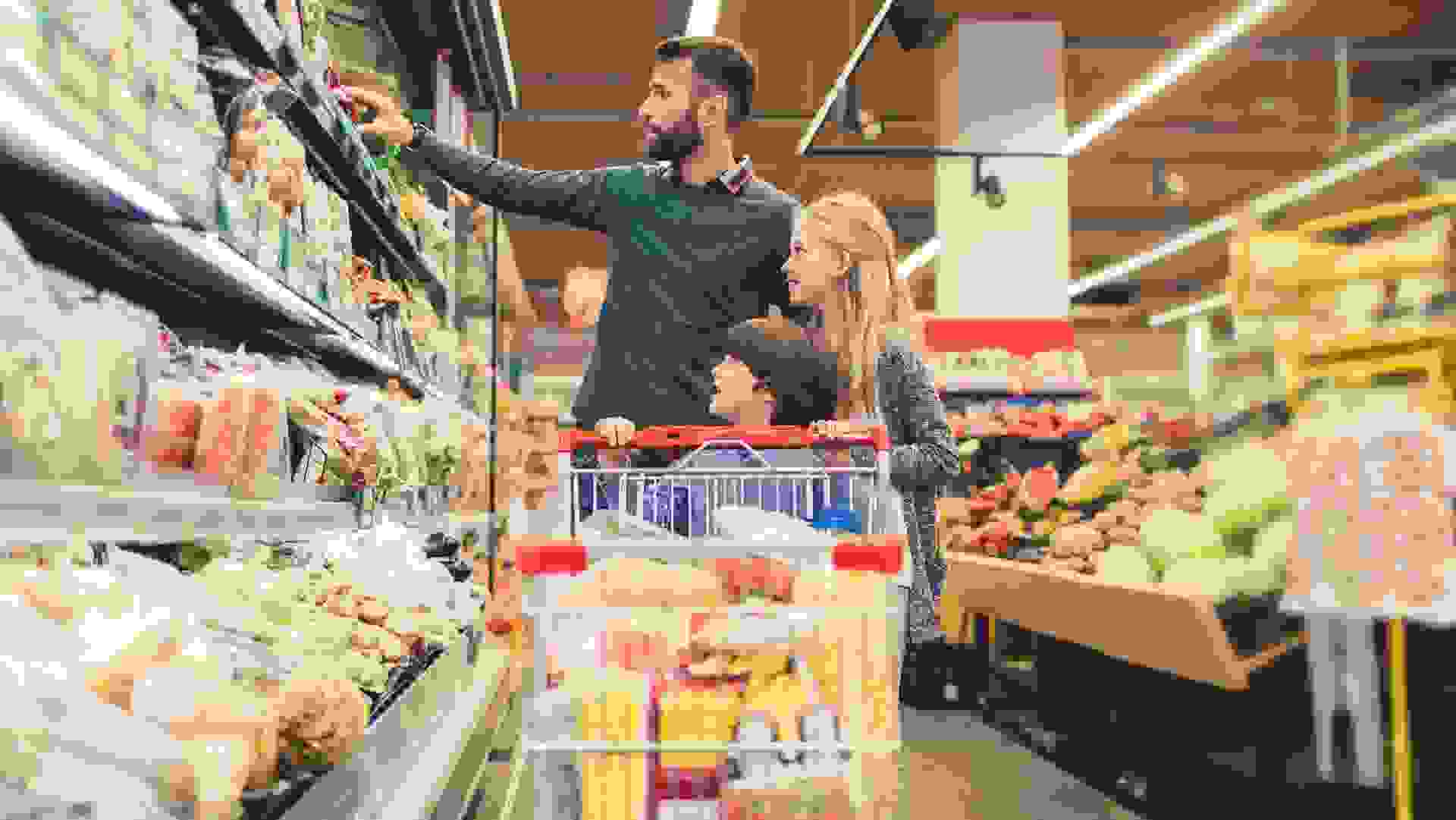 Father with son and daughter In A Supermarket. stock photo
