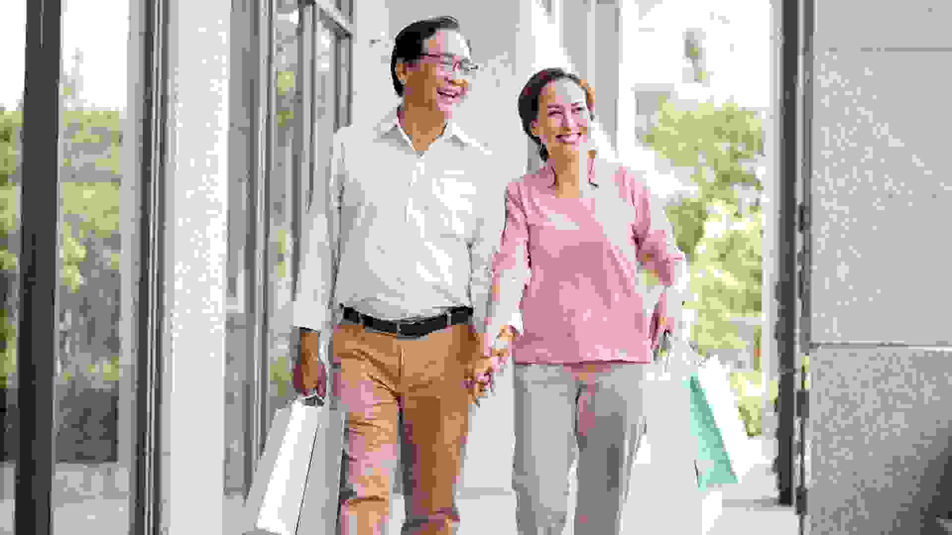 Happy Elderly Couple Shopping stock photo