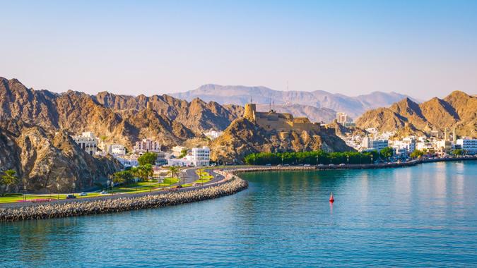 Mountain landscape, harbor and waterfront of Muscat, Oman, Middle East.