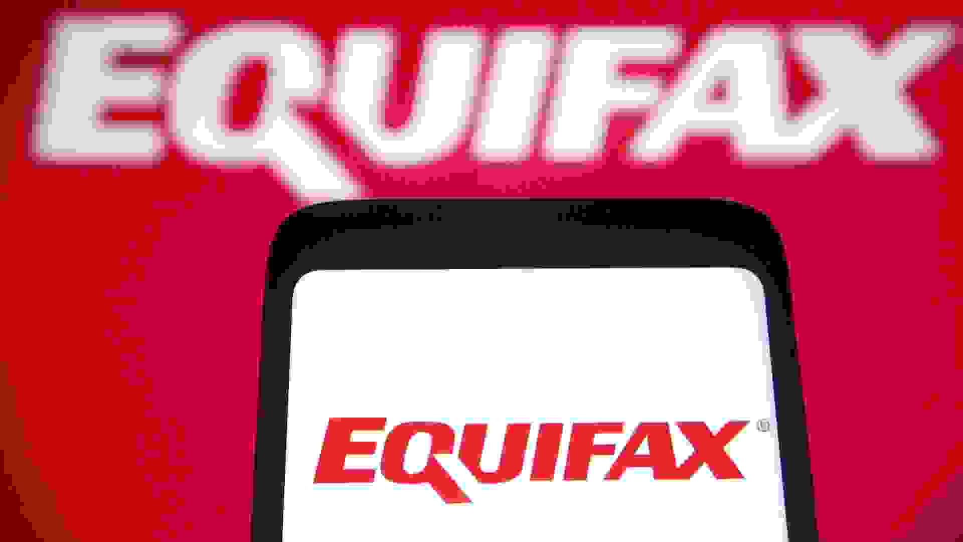 Mandatory Credit: Photo by Pavlo Gonchar/SOPA Images/Shutterstock (12071781e)In this Photo illustration an Equifax logo is seen on a smartphone and a pc screen.