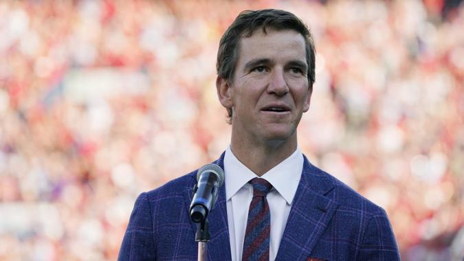 Mandatory Credit: Photo by Rogelio V Solis/AP/Shutterstock (12574423c)Former Mississippi quarterback Eli Manning addresses the crowd as his jersey, number 10, is retired at a half time ceremony during an NCAA college football game against LSU in Oxford, Miss.
