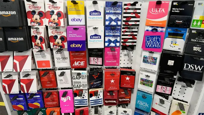Mandatory Credit: Photo by David Zalubowski/AP/Shutterstock (12619225p)Gift cards hang on a display at a Best Buy store after doors opened at 5 a.