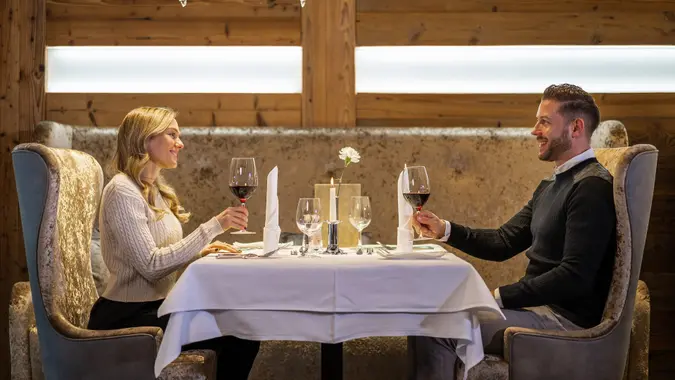 Beautiful couple dining in luxury hotel restaurant stock photo