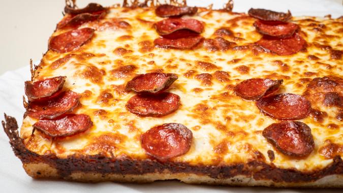 pepperoni deep dish pizza carryout food.