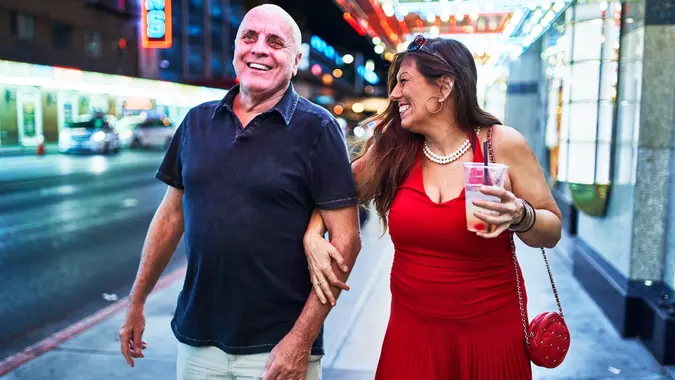 Mature couple sightseeing in downtown las vegas streets stock photo