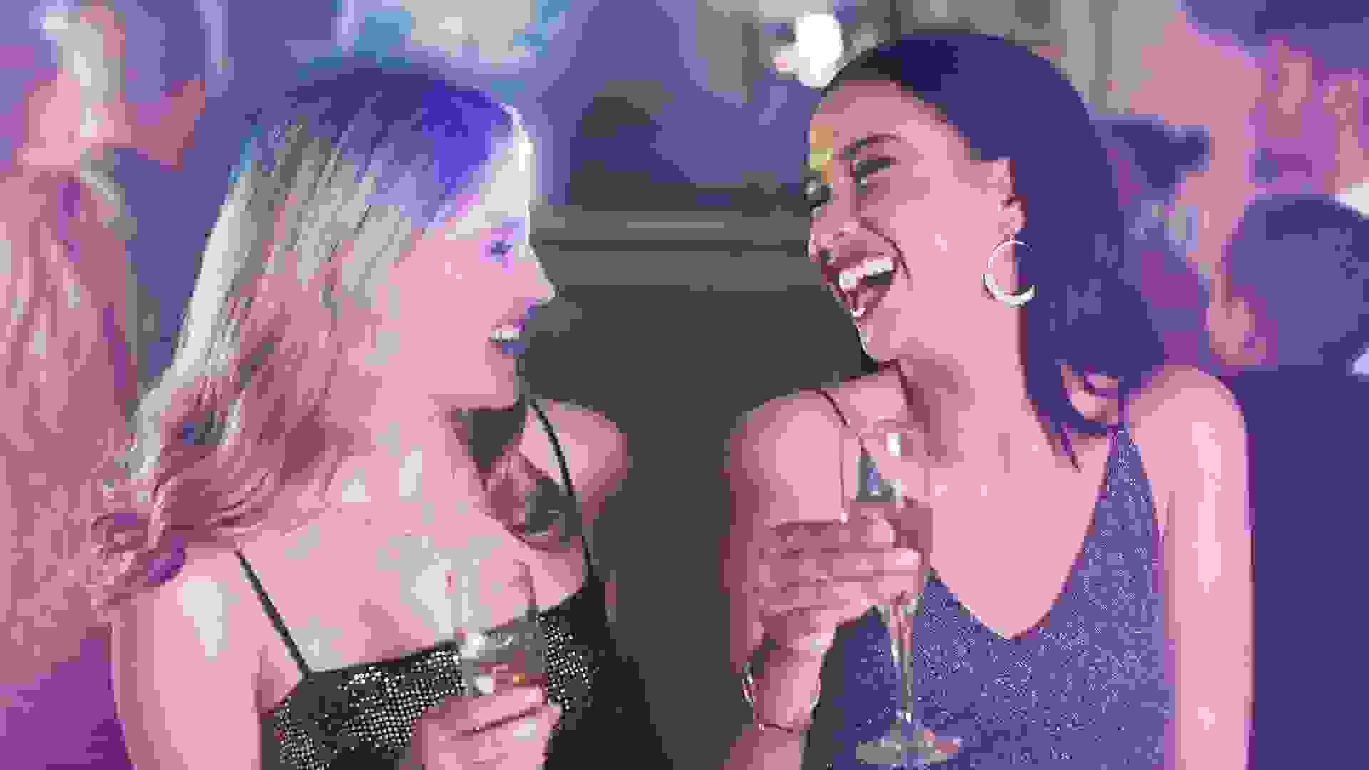 Shot of two young women dancing in a nightclub.