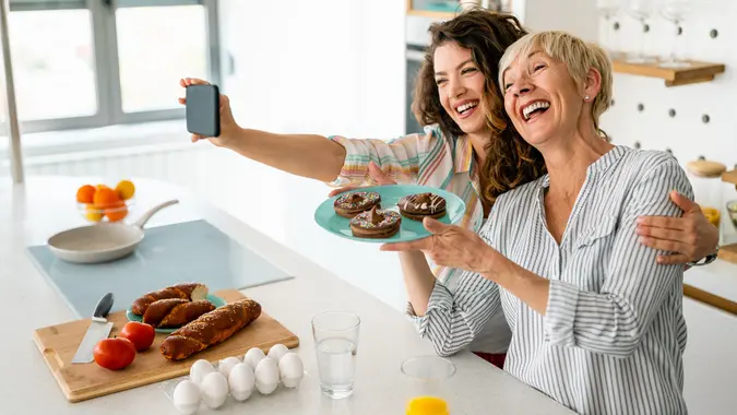 Mother and daughter taking selfie stock photo