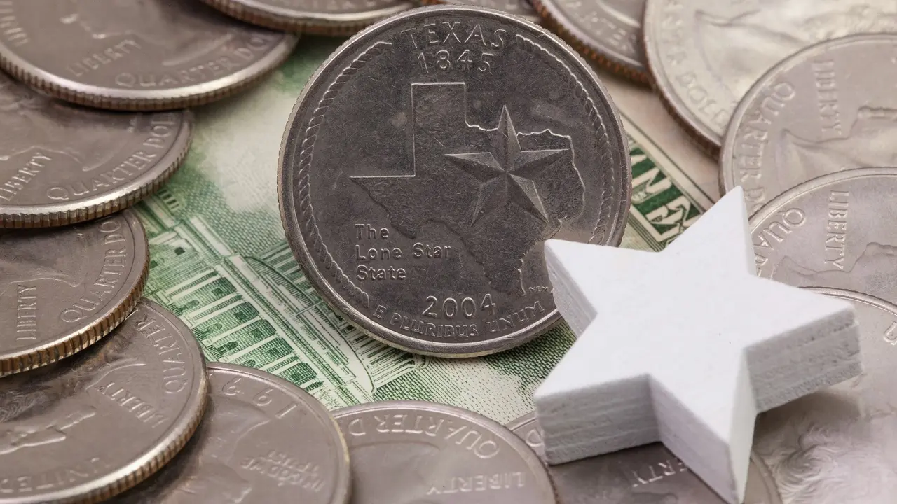 A quarter of Texas, quarters of USA and white star. stock photo