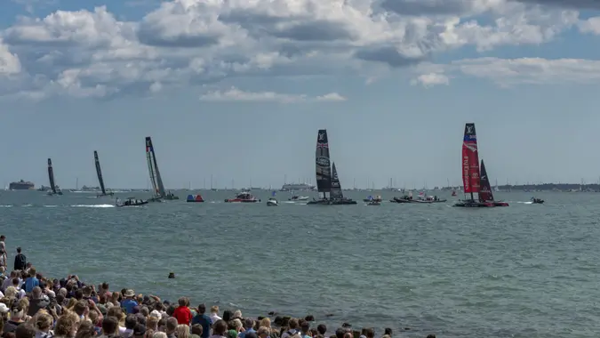 Portsmouth, UK - July 25, 2015: The Team Emirates, Land Rover BAR, Groupama, Team Oracle, and Softbank America's Cup boats sailing in the America's Cup World Series qualifiers in Portsmouth shown on July 25, 2015 in Portsmouth, UK.