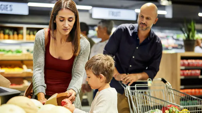 Shot of a family shopping for groceries in a supermarket stock photo