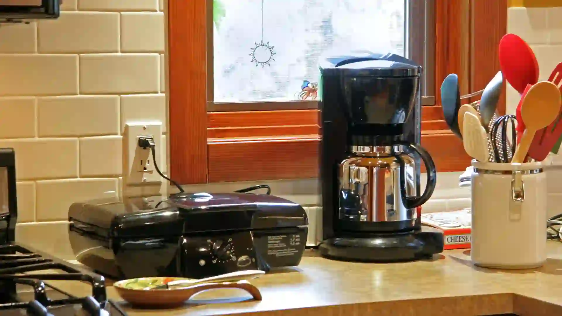 Photography, Color Image, Black, White, Outlet, Cooking Utensil, Serving Utensil, Window Frame, Major Household Appliance, Coffee Maker, Domestic Kitchen, Appliance, Small, Coffee Pot, Barbecue Grill, Indoors, Counter Top, Red, Stainless Steel, Window, Wood, Tile, Copy Space, Horizontal, Kitchen Utensil, Electricity, Electric Plug, Power Cable