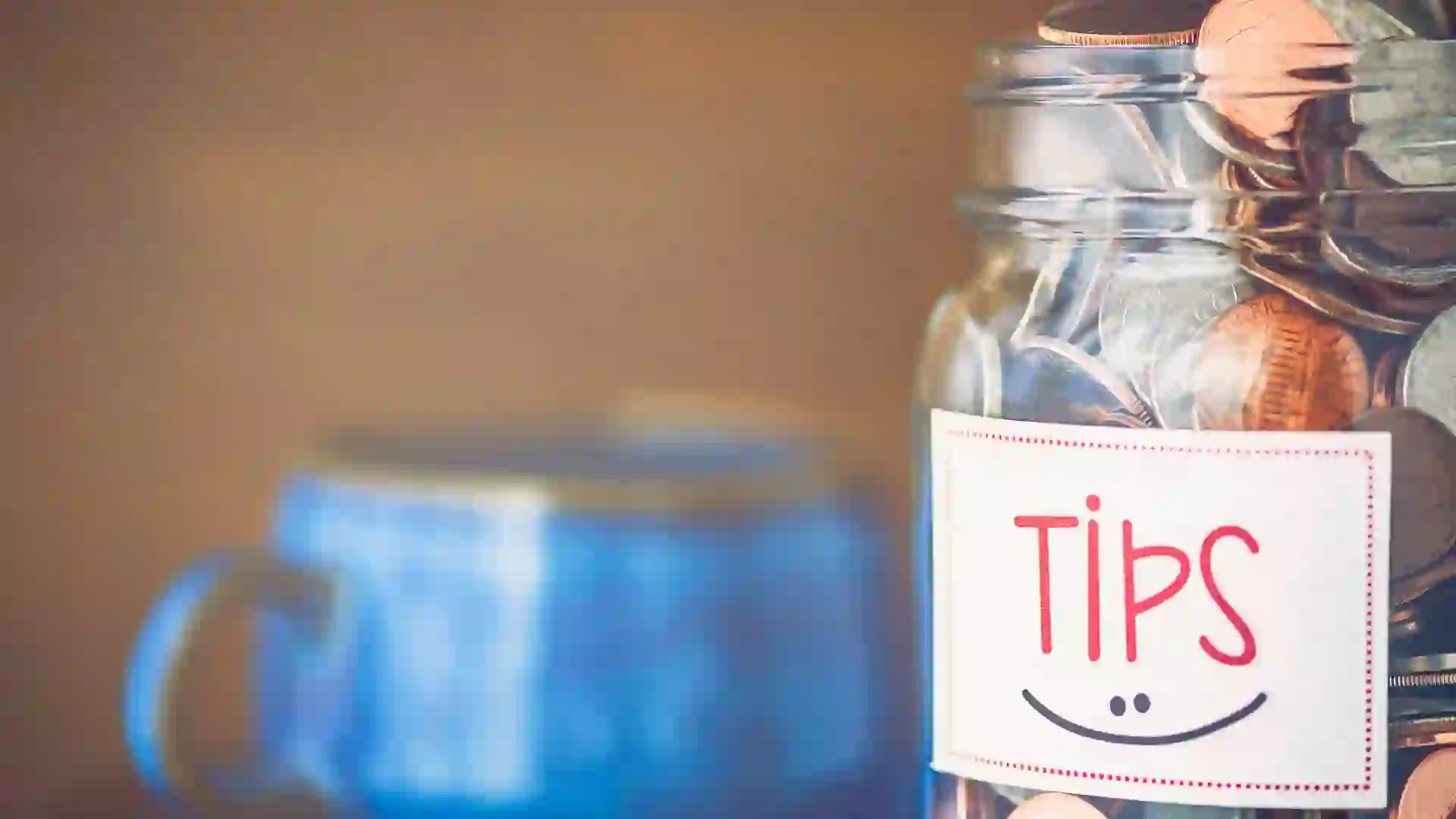 Tip jar in coffee shop or restaurant.