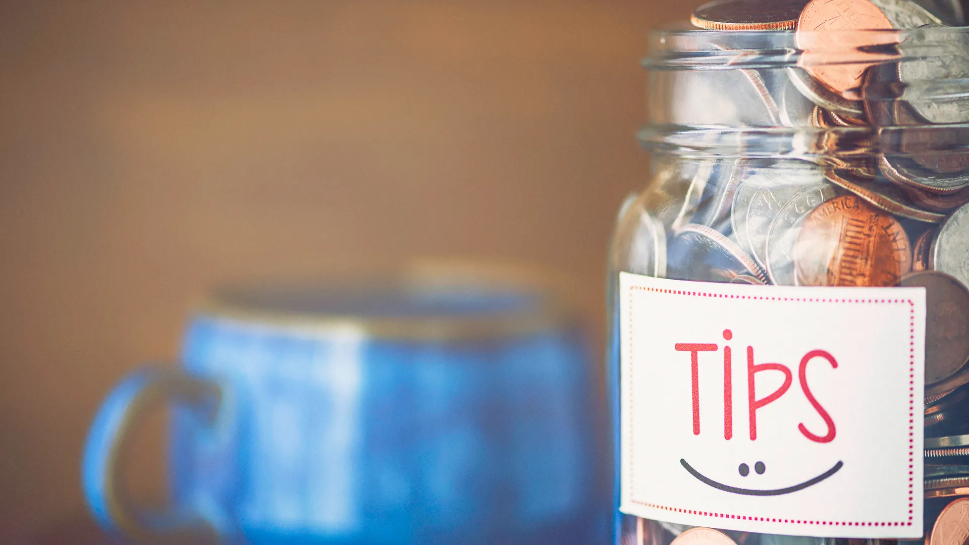 Tip jar in coffee shop or restaurant.