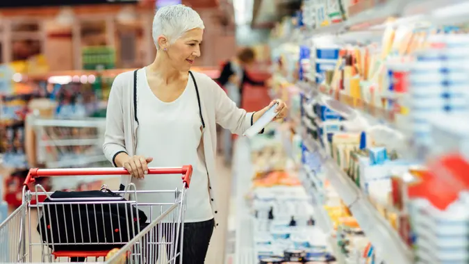 Mature Woman Groceries Shopping. stock photo