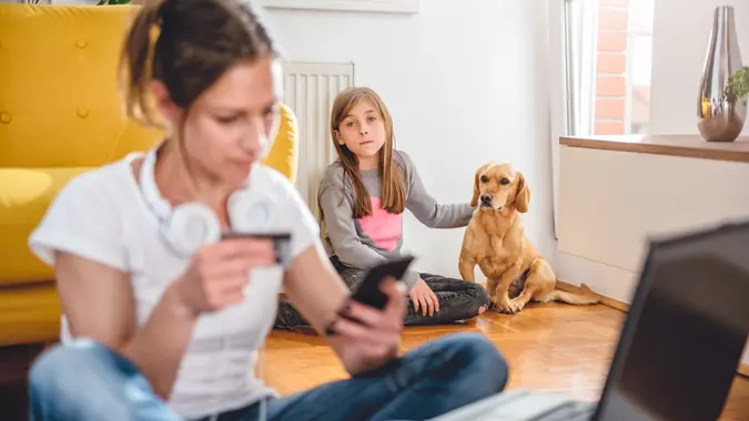 Lonely and sad daughter sitting with dog stock photo