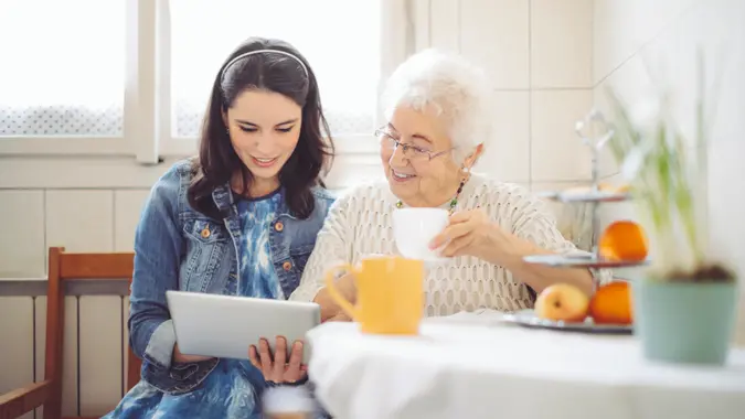 Social worker is visiting a senior woman.