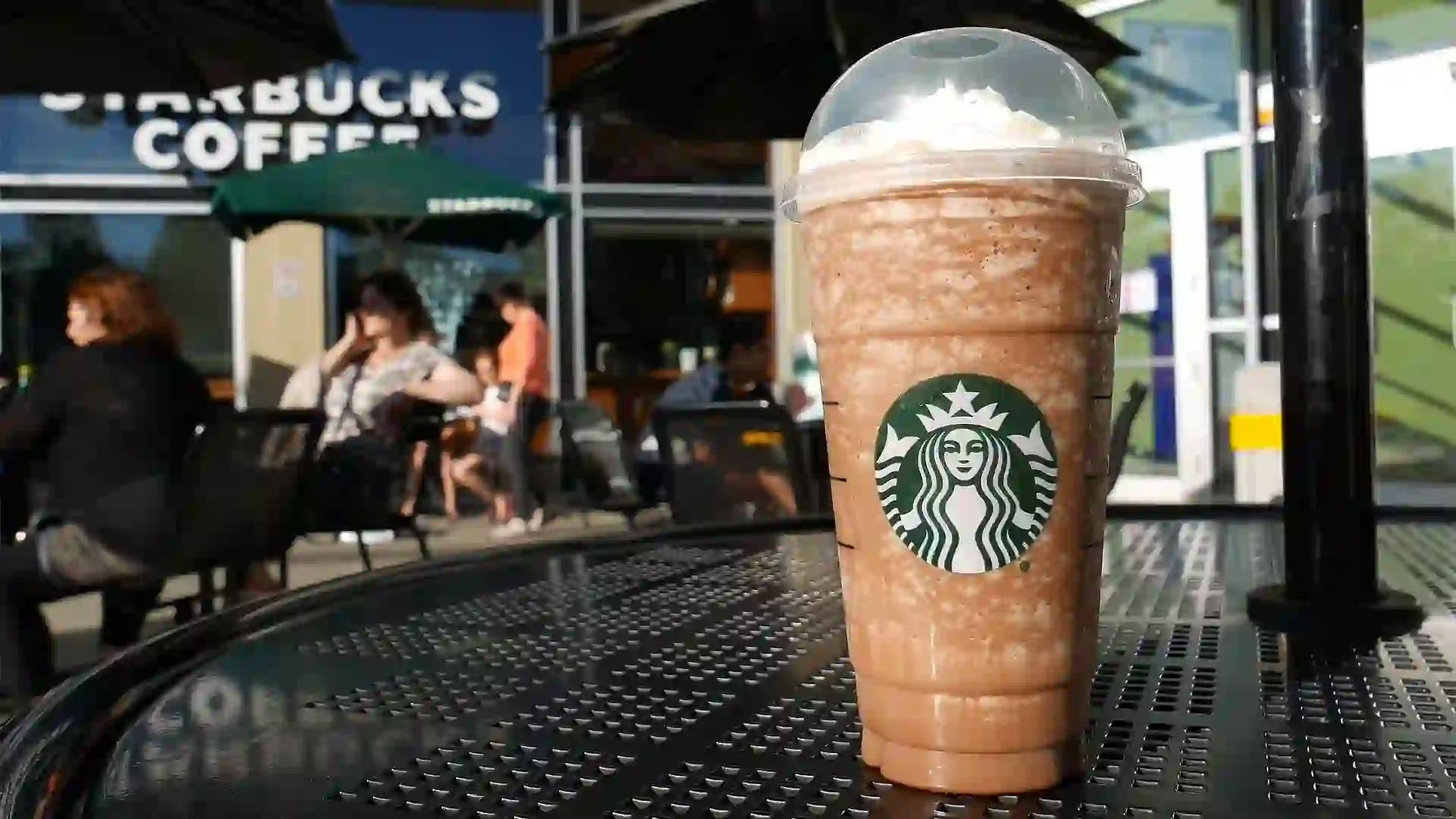 One side of people drinking Starbucks coffee stock photo