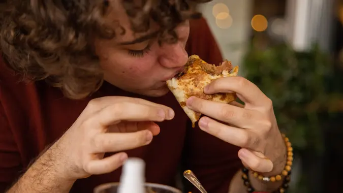 Young Boy Enjoying Eating a Taco stock photo