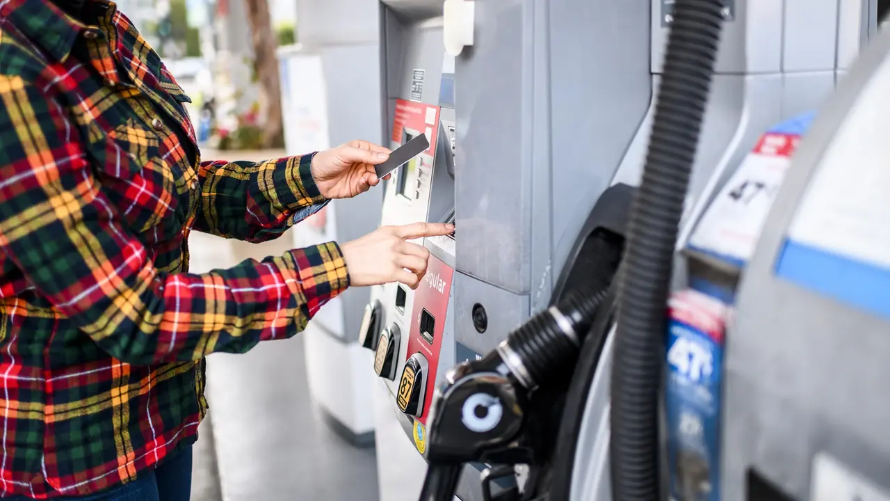 Paying for gas stock photo