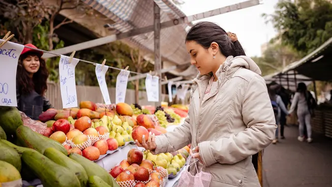 Fruit vendor and customer stock photo