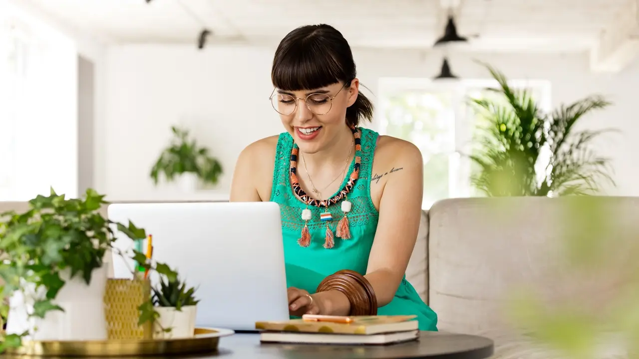 Young woman working in the eco-friendly green office stock photo