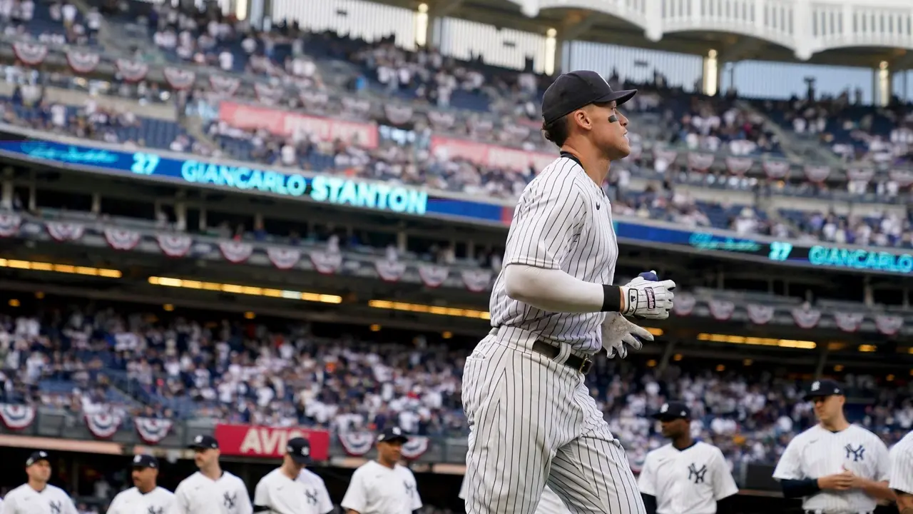 Mandatory Credit: Photo by John Minchillo/AP/Shutterstock (13486527k)New York Yankees right fielder Aaron Judge runs onto the field during player introductions before Game 3 of an American League Championship baseball series against the Houston Astros, in New YorkALCS Astros Yankees Baseball, New York, United States - 22 Oct 2022.