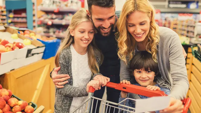 Family shopping in supermarket stock photo