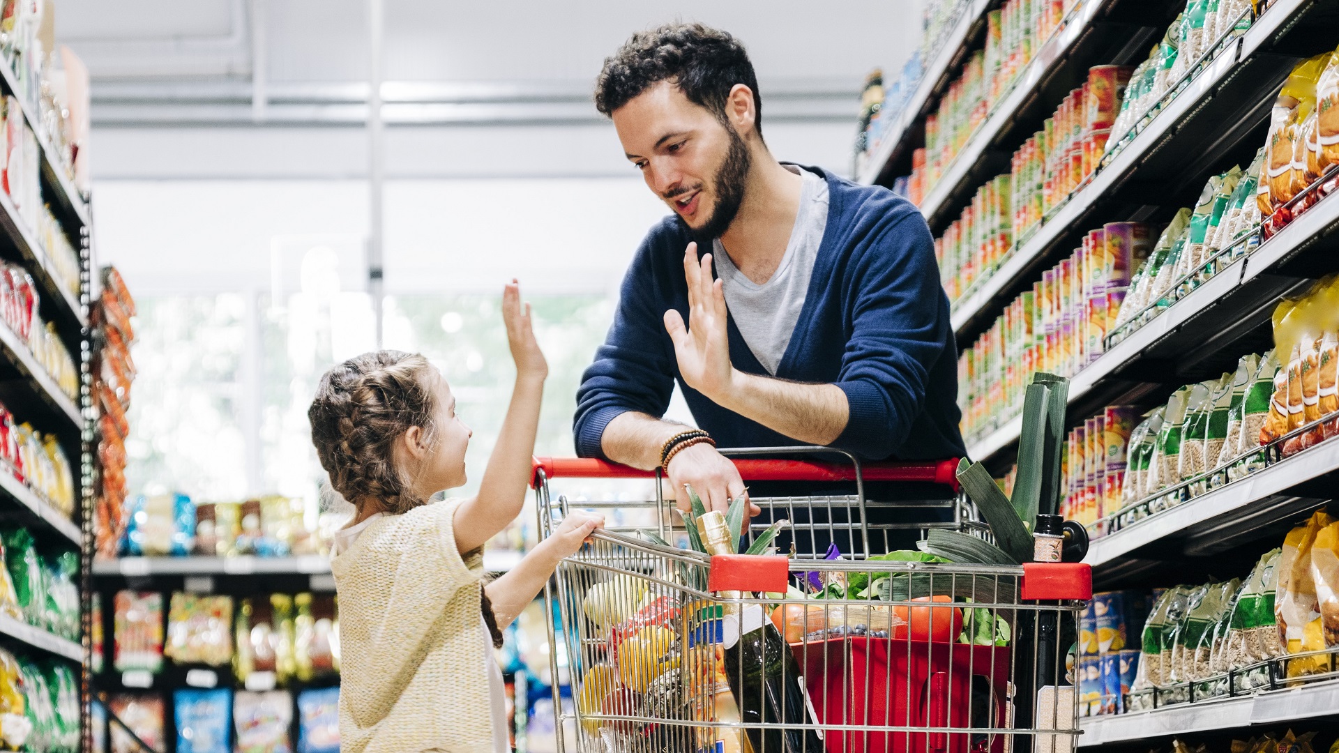 https://cdn.gobankingrates.com/wp-content/uploads/2022/11/father-daughter-high-five-grocery-store-supermarket-aisle_iStock-1341376024.jpg