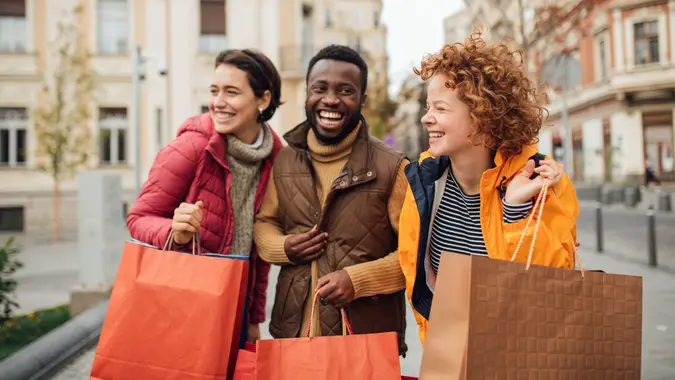 Three friends on a vacation, using an opportunity to shop for Christmas and a new year's presents.